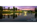 Scenic pond view with reflection of homes at sunset at 3460 Jennings Rd, Union Grove, NC 28689