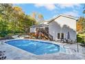 Inviting in-ground pool with surrounding patio and stairs at 2007 Pine Needle Ct, Gastonia, NC 28056