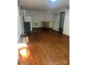 Large room with hardwood floors, suitable for various uses at 3238 Campbell Dr, Charlotte, NC 28205