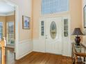 Bright and spacious entryway with hardwood floors and stained glass door at 2916 Redfield Dr, Charlotte, NC 28270