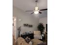 Spacious living room featuring comfortable seating and stylish wall art at 1025 Old Charlotte Rd, Statesville, NC 28677