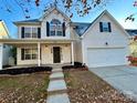 Two-story house with a front porch and attached two-car garage at 19202 Kanawha Dr, Cornelius, NC 28031