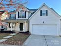 Two-story house with a large front porch and attached two-car garage at 19202 Kanawha Dr, Cornelius, NC 28031