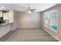 Spacious living room with neutral carpet and large windows at 136 Hamrick Rd, Gastonia, NC 28056