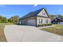 Brick home with attached garage and long driveway at 3318 Sincerity Rd # 7, Monroe, NC 28110