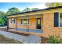 Brick ranch house with covered porch and walkway at 1428 Boxwood Ave, Lancaster, SC 29720