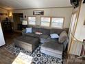 Cozy living room with L-shaped sofa and coffee table at 104 Cardinal Ave, New London, NC 28127
