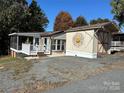 Mobile home with shed and landscaped yard at 104 Cardinal Ave, New London, NC 28127