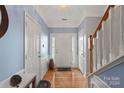 Bright entryway with hardwood floors and staircase at 5313 Dockery Dr, Charlotte, NC 28209