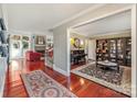 Open living area with hardwood floors and built-in shelving at 235 Dashers Den None, Fort Mill, SC 29708