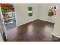 Bright living room with hardwood floors and access to front porch at 2614 Bancroft St, Charlotte, NC 28206