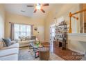 Two-story living room with hardwood floors and fireplace at 212 Primrose Walk, Fort Mill, SC 29715