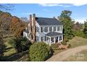 Aerial view of a historic home on a spacious lot at 104 Leslie Loop, Mooresville, NC 28115