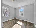 Bright and airy bedroom with neutral walls and wood-look flooring at 728 Jefferson Ave, Rock Hill, SC 29730