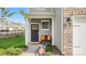 Inviting front entrance of a townhome with a porch, pumpkins, and fall decor at 3878 Fairlady Ln, Fort Mill, SC 29707