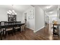 Formal dining room with dark wood table and hardwood floors at 1568 Whitman Ct, York, SC 29745