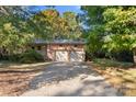 Brick ranch house with a two-car garage and driveway at 1102 W Elm St, Shelby, NC 28152