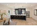 Modern kitchen with large island and stainless steel appliances at 103 Buck Hill Rd, Monroe, NC 28112