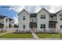 Stylish two-story white townhouse with black accents and a white picket fence at 376 Bly St, Rock Hill, SC 29732