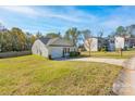 Yellow ranch home with a 2-car garage and yard at 825 Finley View Dr, Rock Hill, SC 29730