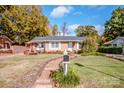 Brick ranch home with landscaped yard and brick walkway at 834 Brookwood Dr, Mooresville, NC 28115