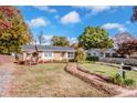 Brick ranch home with landscaped yard and brick walkway at 834 Brookwood Dr, Mooresville, NC 28115