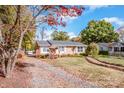 Brick ranch home with landscaped yard and brick walkway at 834 Brookwood Dr, Mooresville, NC 28115