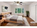 Main bedroom with wood flooring, large window, and ample closet space at 1259 Blacksnake Rd, Stanley, NC 28164