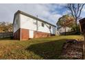 Back of the house with brick foundation and a yard at 503 Cherry St, Belmont, NC 28012