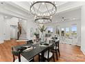 Elegant dining room featuring a large chandelier and a spacious table for six at 108 Augusta Ln, Shelby, NC 28150