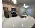 Modern kitchen with a large island and stainless steel appliances at 20 Hamiltons Harbor Dr # 838, Clover, SC 29710