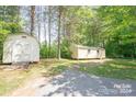 Two separate storage sheds in the backyard at 1668 Lane Rd, Mount Holly, NC 28120