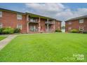 Brick building with lawn and balconies at 2123 Carriage Woods Ln, Kannapolis, NC 28081