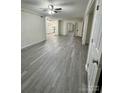 Spacious living room with grey vinyl flooring at 2123 Carriage Woods Ln, Kannapolis, NC 28081