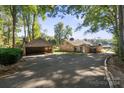 Lakefront home with carport and paved driveway at 364 Catalina Dr, Mooresville, NC 28117