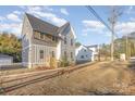 Two-story craftsman style home with gray siding and a charming front porch at 607 Julia Ave, Belmont, NC 28012