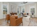 Spacious living room featuring hardwood floors, large windows, and comfortable seating at 607 Julia Ave, Belmont, NC 28012