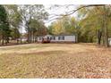 Single-wide mobile home on a wooded lot at 2353 S Springhill Ct, York, SC 29745