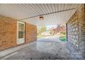 Brick carport with door and view of yard at 7 Burnett Dr, York, SC 29745