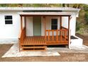 Covered wooden porch with steps and railing at 2869 9Th Se Ave, Hickory, NC 28602