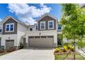 Townhouse exterior with attached garage and landscaping at 14905 Tamarack Dr, Charlotte, NC 28278