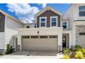 Townhouse exterior with attached garage and landscaping at 14905 Tamarack Dr, Charlotte, NC 28278