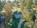 An aerial view of a house nestled amongst lush greenery at 94 Heritage Dr, Lake Wylie, SC 29710