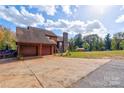 Two-story wood house with attached garage at 831 College Ave, Shelby, NC 28152