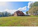 Two-story wood house with deck and large yard at 831 College Ave, Shelby, NC 28152