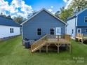 Back of house, featuring a deck and backyard at 606 Meadow Ave, Spencer, NC 28159