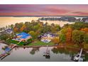Stunning waterfront property with expansive lake views and lush landscape at 16500 Green Dolphin Ln, Cornelius, NC 28031