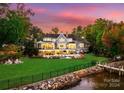 Lakefront home with a gorgeous backyard, pool, and dock at 16500 Green Dolphin Ln, Cornelius, NC 28031