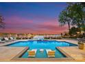 Inviting saltwater pool with expansive lake views and comfortable seating at 16500 Green Dolphin Ln, Cornelius, NC 28031