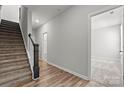 Bright hallway with carpeted stairs and hardwood floors at 7117 Brookview Ln, Sherrills Ford, NC 28673